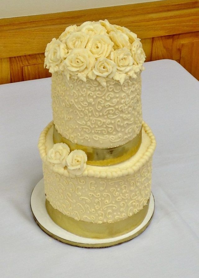 Order this cake in its smallest version (as seen here) for $150.00 (serves 50-60) or order a larger version of this cake, with additional tiers and a decorated cake board to fit you budget and celebration size.